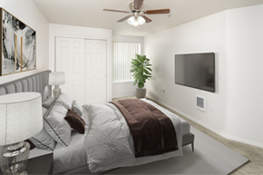 Keizer apartment for rent - Two-Bedroom Apartments in Keizer, OR- The Village- Ceiling Fan with Sliding Doors to Closet and Tall Potted Plant at THE VILLAGE Apartments, KEIZER, OR 97303
