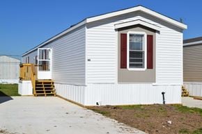 Houston apartment for rent - a small white house with a sidewalk in front of it