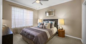 Houston apartment for rent - Spacious bedroom with walk-in closet and ceiling fan at The Lanesborough Apartments in Houston.
