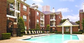 Houston apartment for rent - Luxury swimming pool with spacious sundeck, beautiful landscaping, and pool-side lounge seating at Tuscany Lane Apartments in Houston.