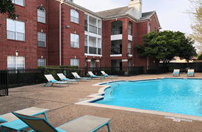 Houston apartment for rent - Luxury swimming pool with spacious sundeck, beautiful landscaping, and poolside lounge seating at Tuscany Park Apartments in Houston.