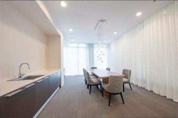 Vancouver apartment for rent - A modern kitchen with a dining table and chairs.