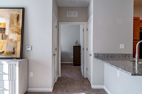 Shelbyville apartment for rent - a kitchen with a counter top and a hallway with a door to a bedroom