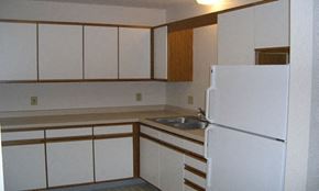 Rice apartment for rent - kitchen with white cupboards