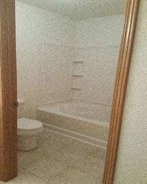 Mankato townhouse for rent - a small bathroom with a toilet and a bath tub