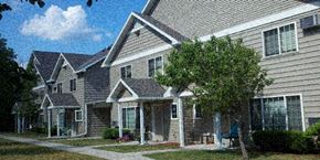 Mankato townhouse for rent - a house with a tree in front of it