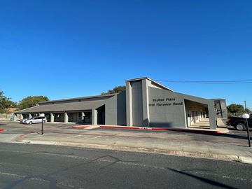 Killeen apartment for rent - A building with the words "Skyline Plaza" on the front.