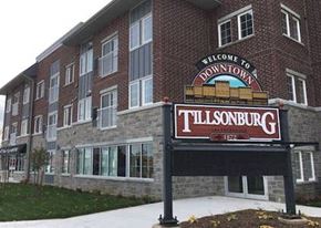 Tillsonburg apartment for rent - a sign in front of a large brick building