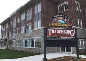 Tillsonburg apartment for rent - a sign in front of a large brick building