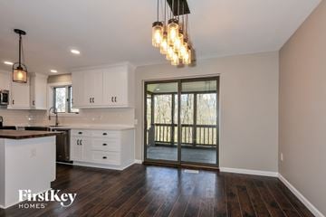 Lake Saint Louis house for rent - A kitchen with a white counter top and wooden floors.