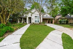 Humble house for rent - a white house with a lawn and a sidewalk in front of it