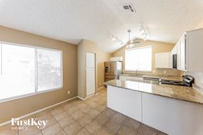 Peoria house for rent - a kitchen with a counter top and a large window