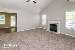 Charlotte house for rent - the living room of an empty house with a fireplace