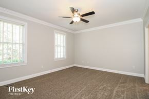 Winston-Salem house for rent - the master bedroom has a carpeted floor and a ceiling fan