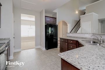Lexington house for rent - a large kitchen with granite counter tops and stainless steel appliances