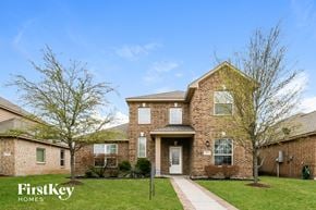 Red Oak house for rent - A brick house with a white door and windows is for sale.