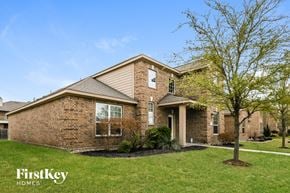 Red Oak house for rent - A brick house with a tree in front of it.