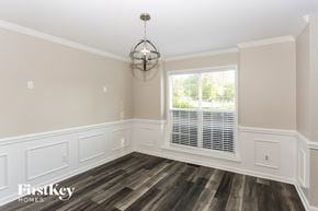 Charlotte house for rent - a dining room with wood flooring and a window