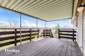Middletown house for rent - a spacious deck with a view of the mountains and trees