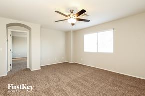 San Tan Valley house for rent - a bedroom with carpet and a ceiling fan