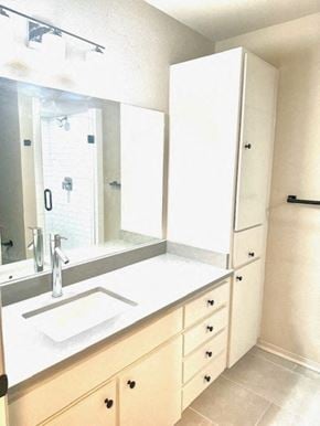 San Antonio apartment for rent - A white bathroom with a sink, mirror, and cabinets.