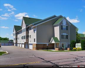 Sauk Rapids apartment for rent - an apartment building with a street in front of it