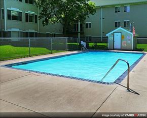 Sauk Rapids apartment for rent - a swimming pool in front of an apartment building