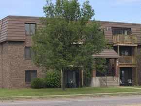 St Cloud apartment for rent - a brick apartment building with a tree in front of it