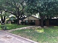 Temple house for rent - A house with a driveway and trees in front of it.