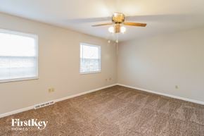 West Chester house for rent - a bedroom with carpet and a ceiling fan