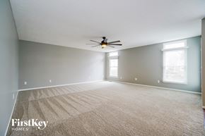 Delaware house for rent - the living room of an empty house with a ceiling fan