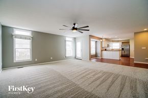 Delaware house for rent - an empty living room with a ceiling fan and a rug