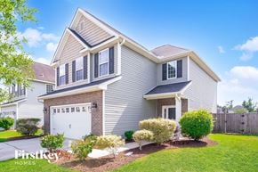 Ladson house for rent - A house with a garage and a driveway.