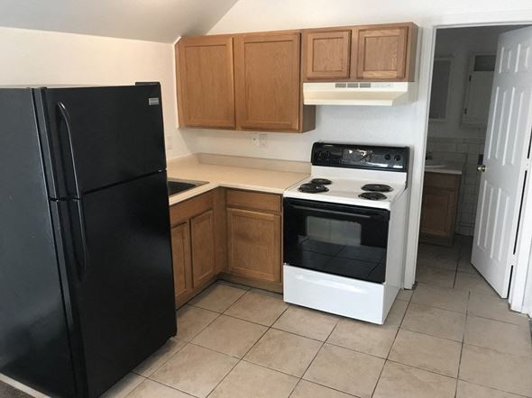 Colorado Springs apartment for rent - a kitchen with a stove and a refrigerator