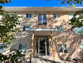 Regina apartment for rent - The front of a building with a sign that says "The Ismore".