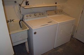 Severn house for rent - a washing machine and a sink in a room