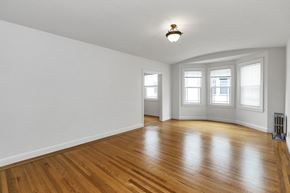 San Francisco apartment for rent - an empty living room with white walls and wood floors