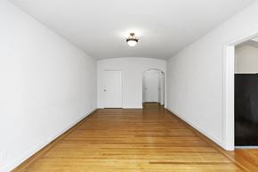 San Francisco apartment for rent - a room with a wooden floor and white walls and a white door