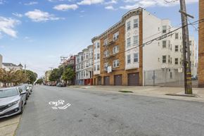 San Francisco apartment for rent - a street view of an apartment building on a city street