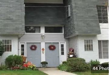 Old Bridge apartment for rent - A house with a grey front door and two wreaths on the door.