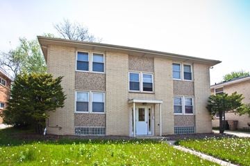 Madison apartment for rent - the front of a brick apartment building with a white door