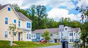 North East apartment for rent - a row of houses with a speed limit sign