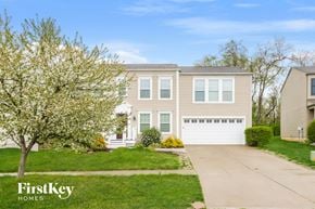 Morrow house for rent - A house with a tree in front of it and the words "FirstKey Homes" on the bottom left.
