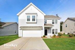 Moncks Corner house for rent - a white house with a white garage door