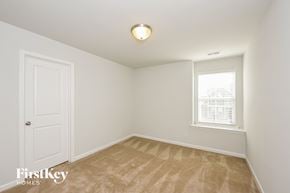 Moncks Corner house for rent - a bedroom with white walls and a white door and a window