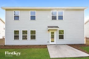 Moncks Corner house for rent - the front of a white house with a driveway and grass