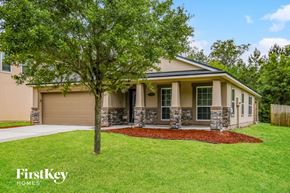 Jacksonville house for rent - A house with a tree in front of it.