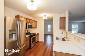 Noblesville house for rent - a kitchen with stainless steel appliances and a white counter top
