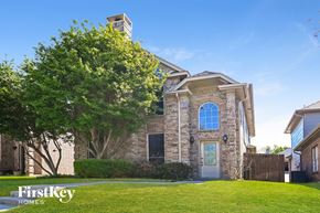 Carrollton house for rent - A house with a tree in front of it.