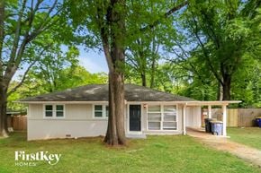 Kennesaw house for rent - a small white house with a tree in front of it